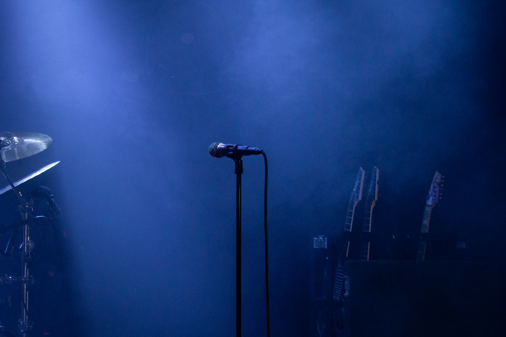 black microphone on stand near microphone stand